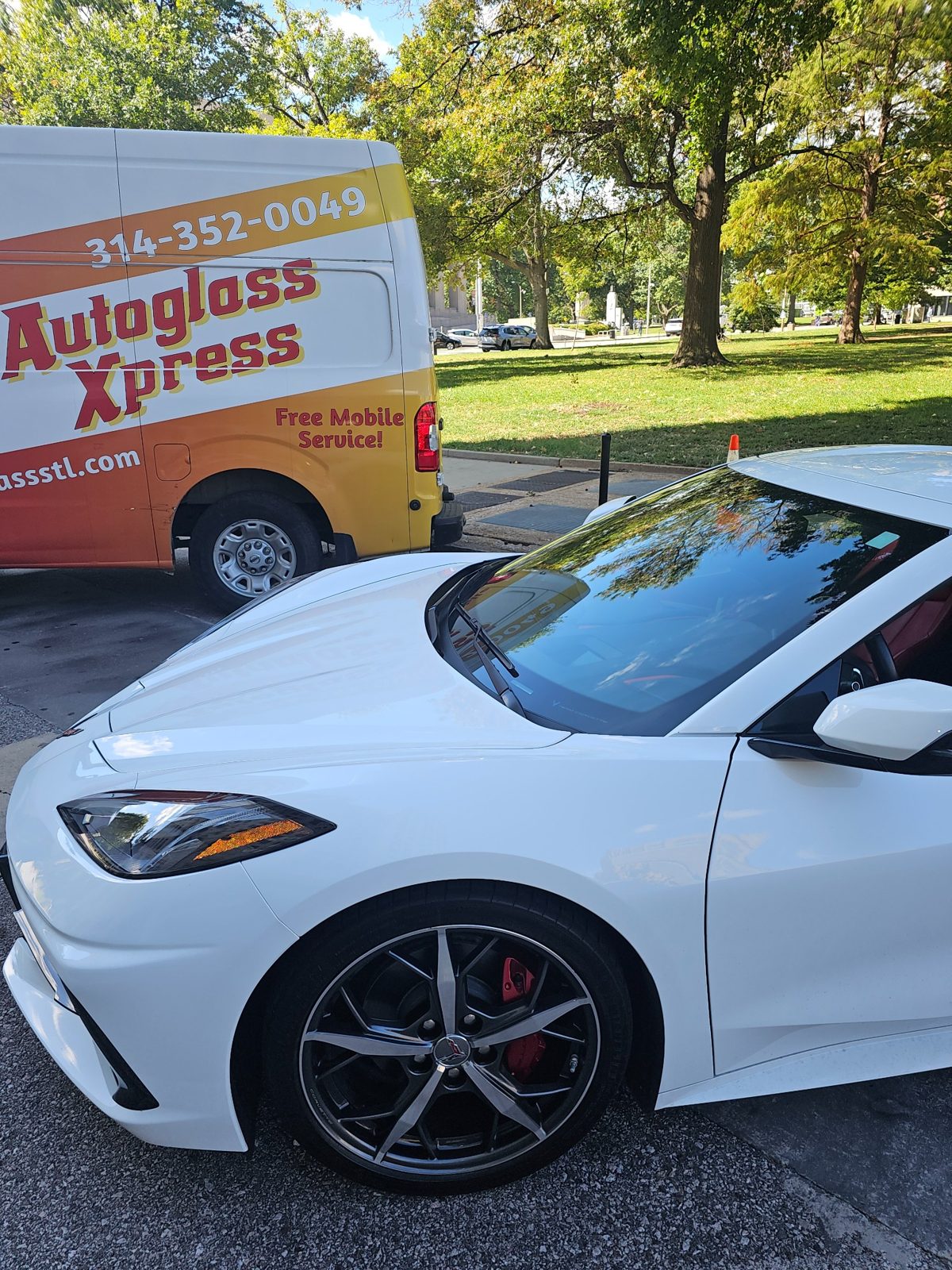Auto Glass Xpress mobile windshield replacement service van with Corvette in St. Louis Missouri