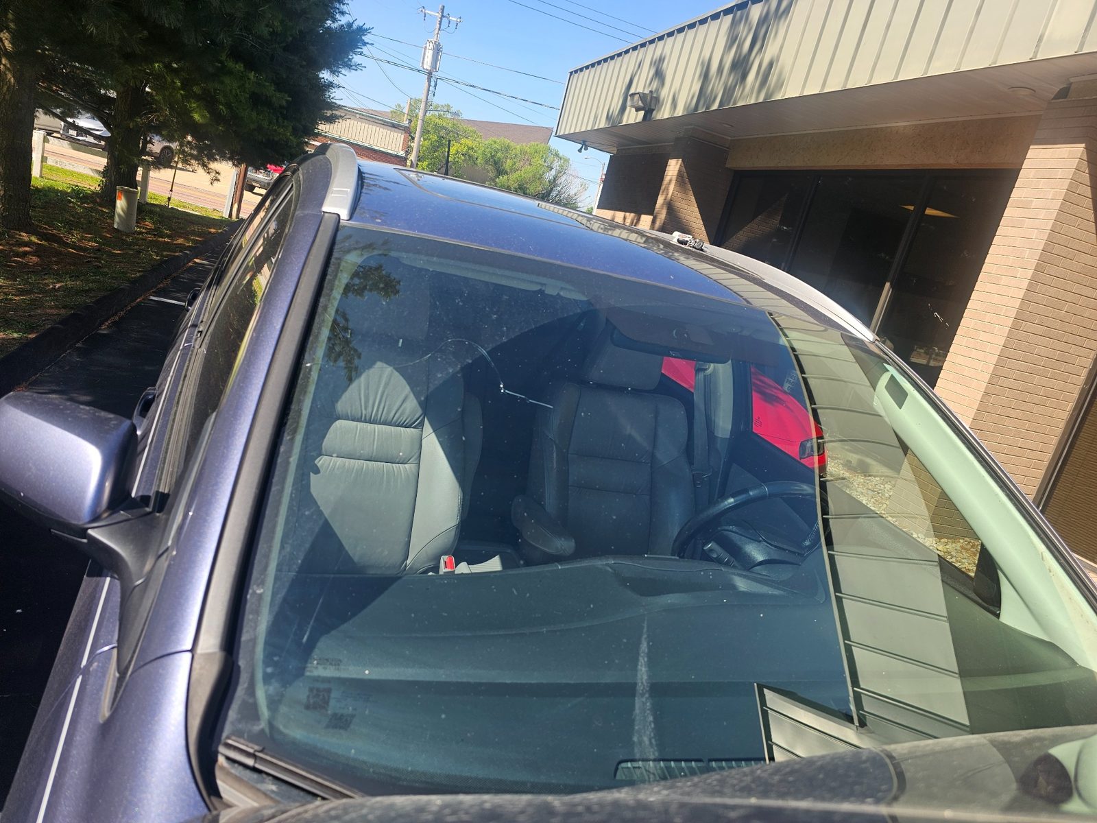 Cracked windshield before replacement by Auto Glass Xpress in St. Louis Missouri